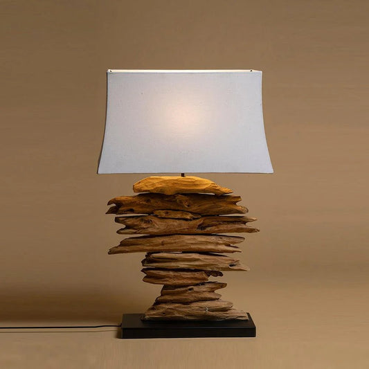 Bring the essence of nature into your home with the Driftwood Teak Lamp,