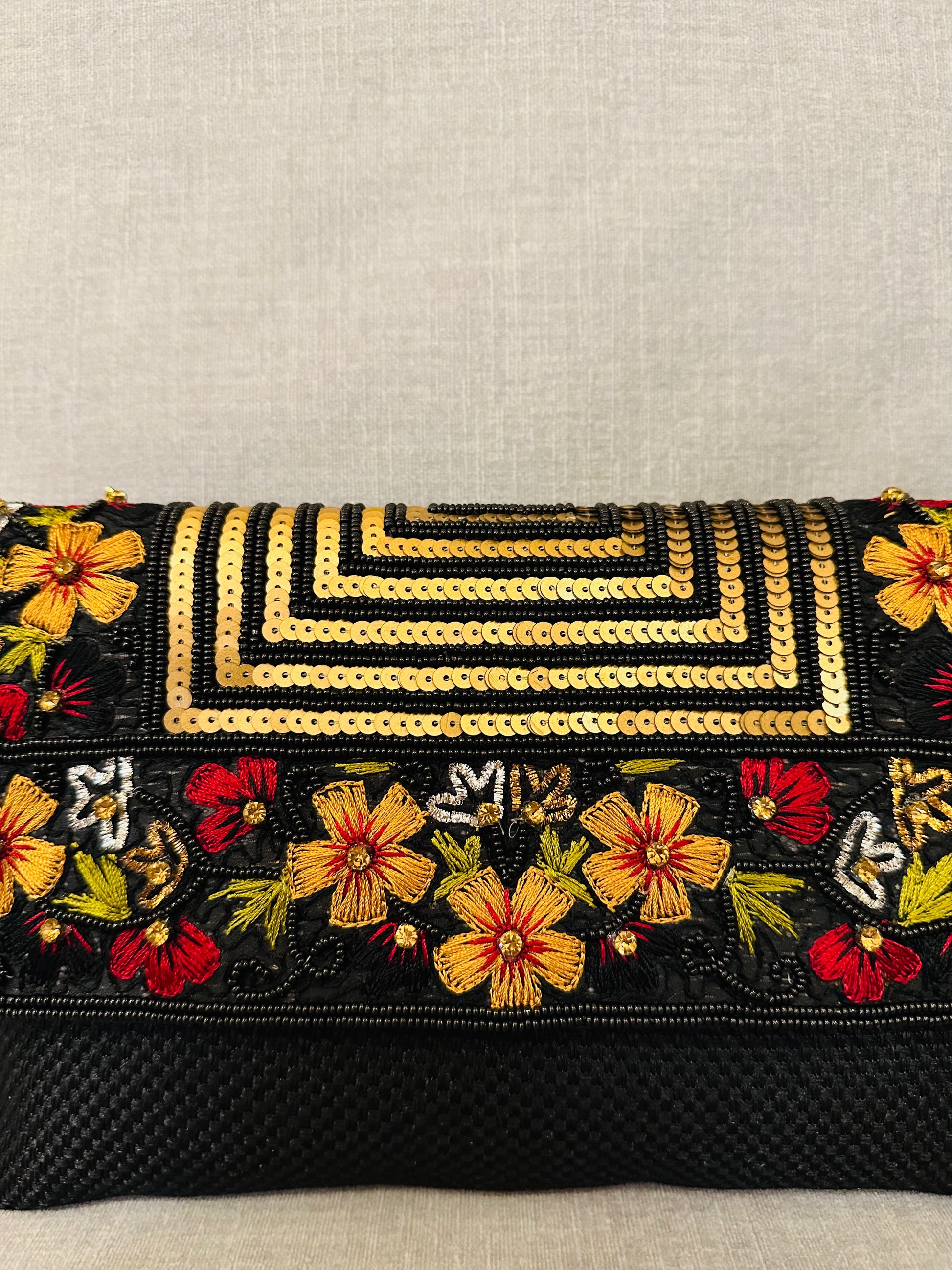 Handcrafted jute clutch with gold zardozi embroidery, magnetic closure, traditional Indian Bhopali Batua design