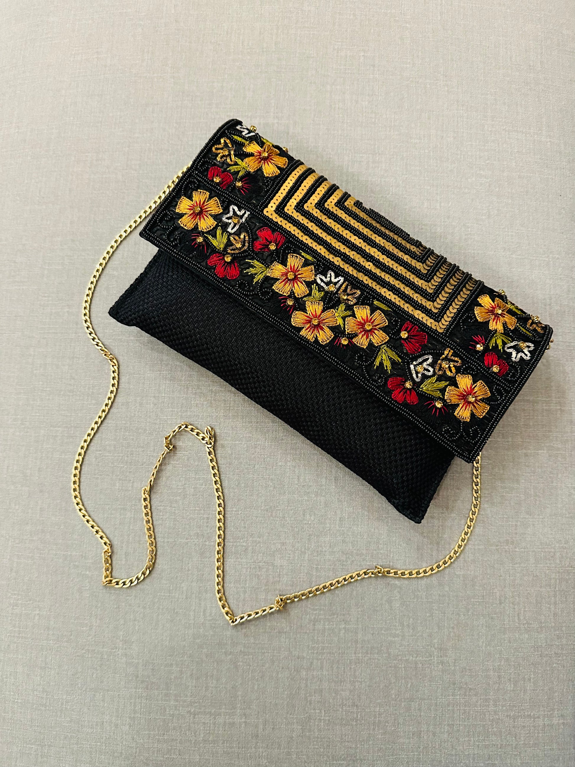 Handcrafted jute clutch with gold zardozi embroidery, magnetic closure, traditional Indian Bhopali Batua design