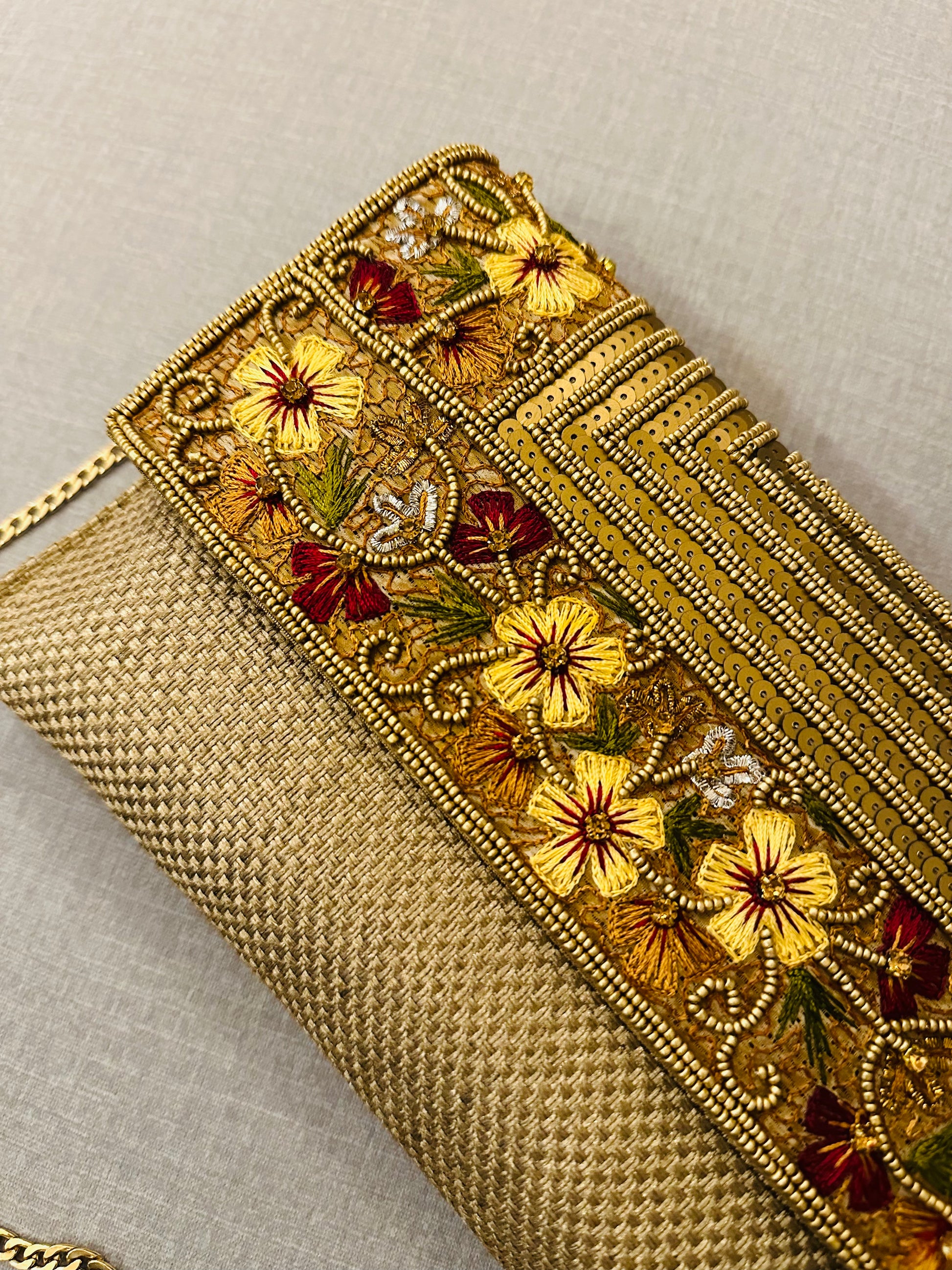 Handcrafted jute clutch with gold zardozi embroidery, magnetic closure, traditional Indian Bhopali Batua design