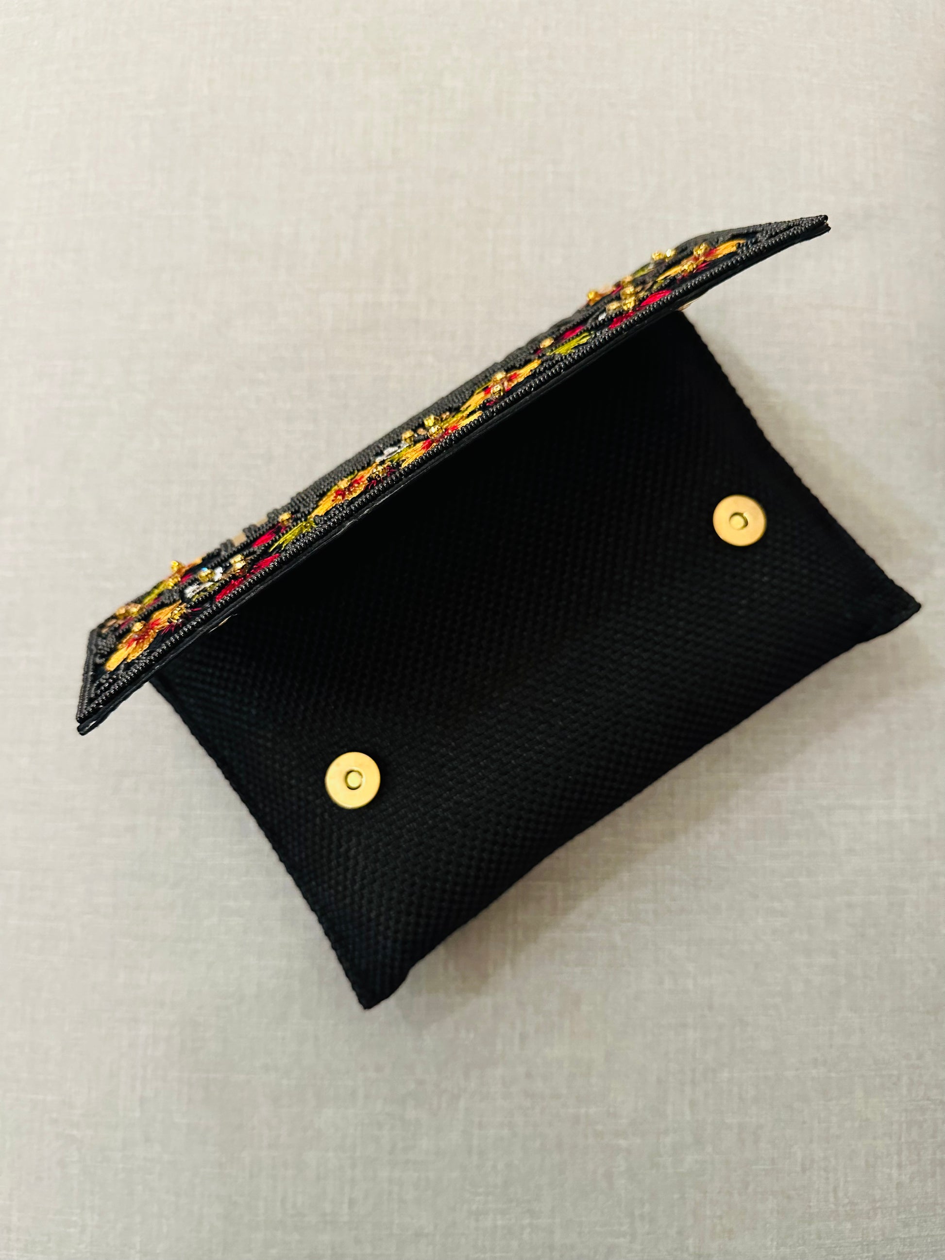 Handcrafted jute clutch with gold zardozi embroidery, magnetic closure, traditional Indian Bhopali Batua design