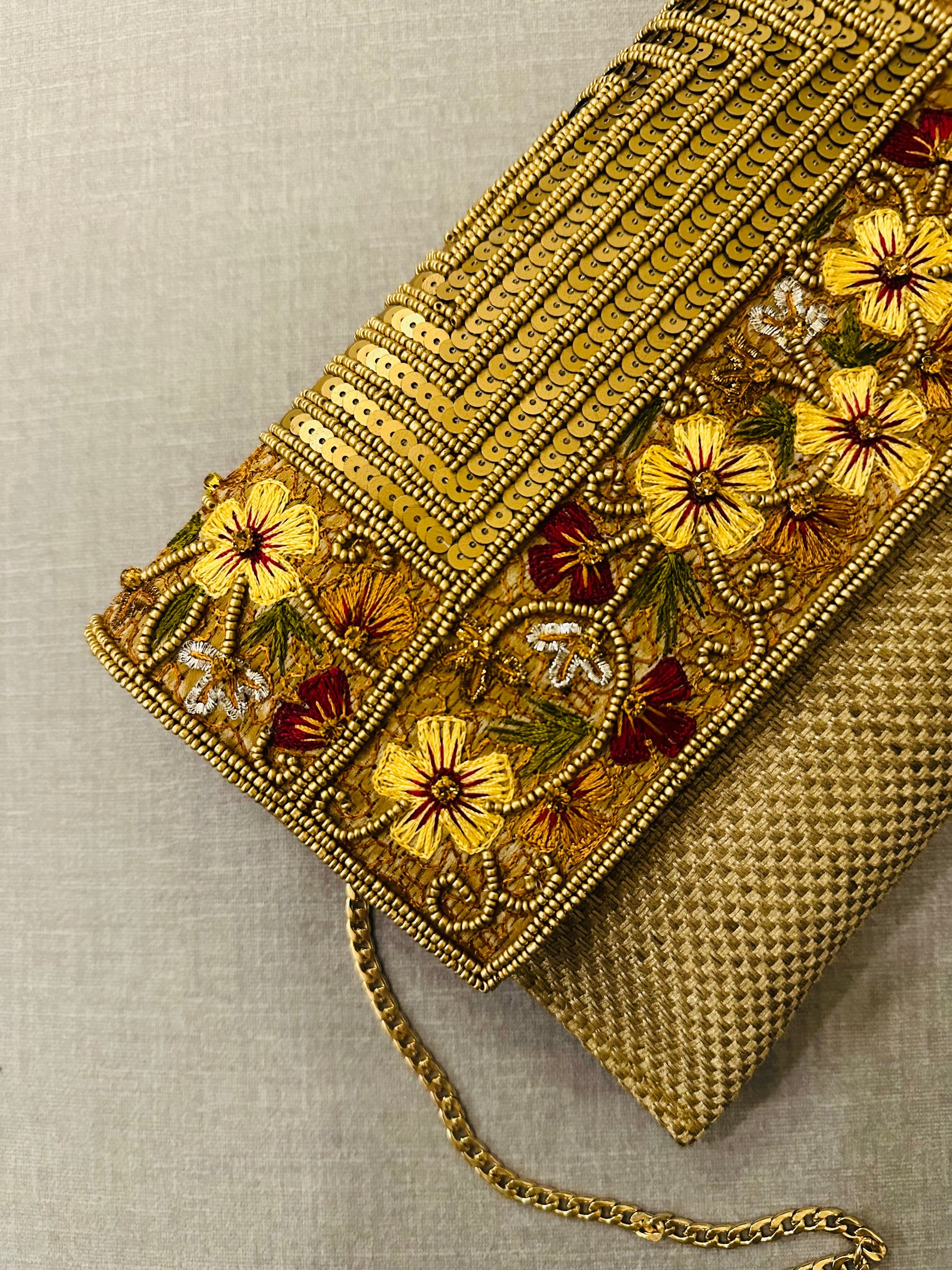 Handcrafted jute clutch with gold zardozi embroidery, magnetic closure, traditional Indian Bhopali Batua design