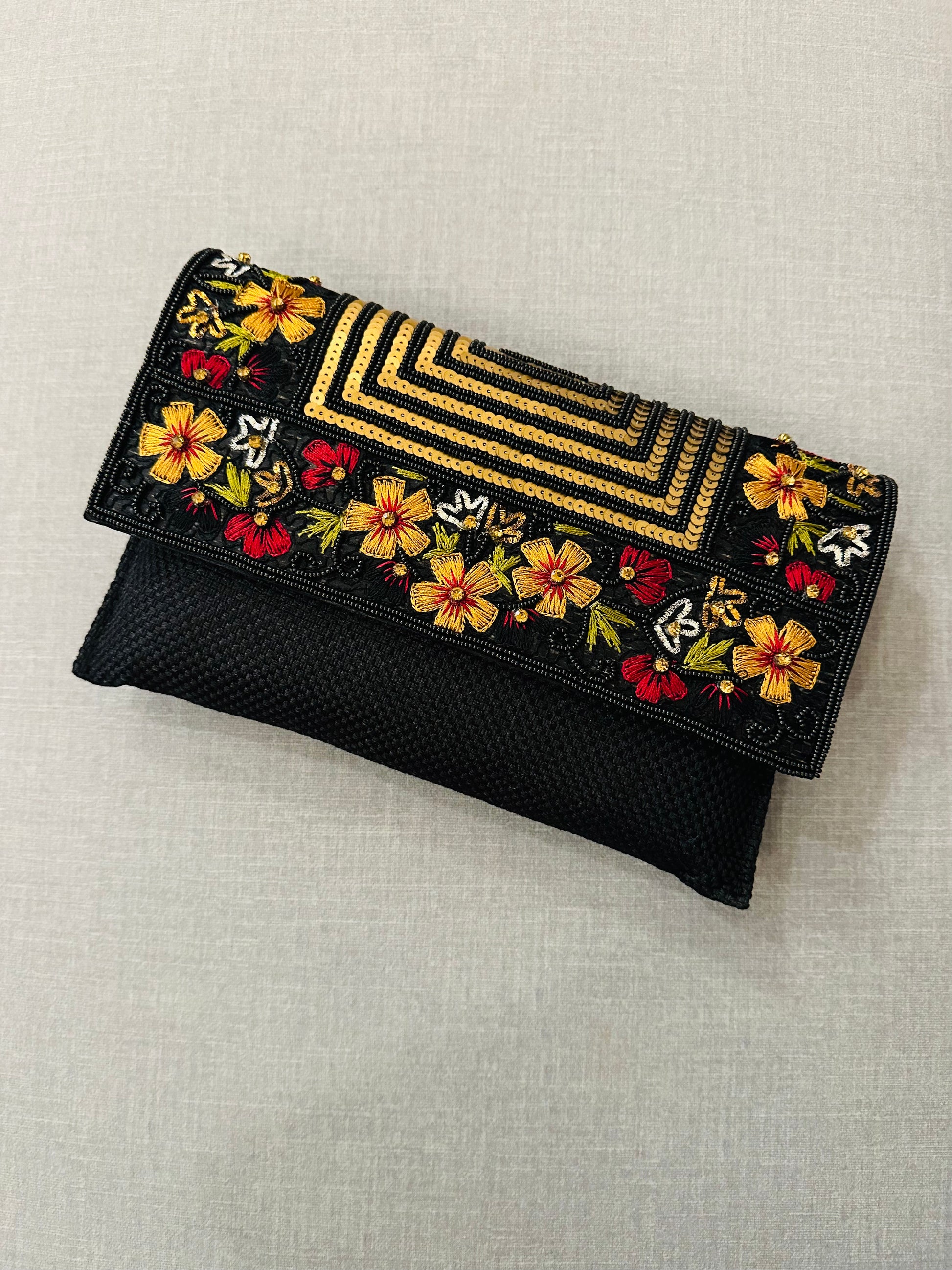 Handcrafted jute clutch with gold zardozi embroidery, magnetic closure, traditional Indian Bhopali Batua design