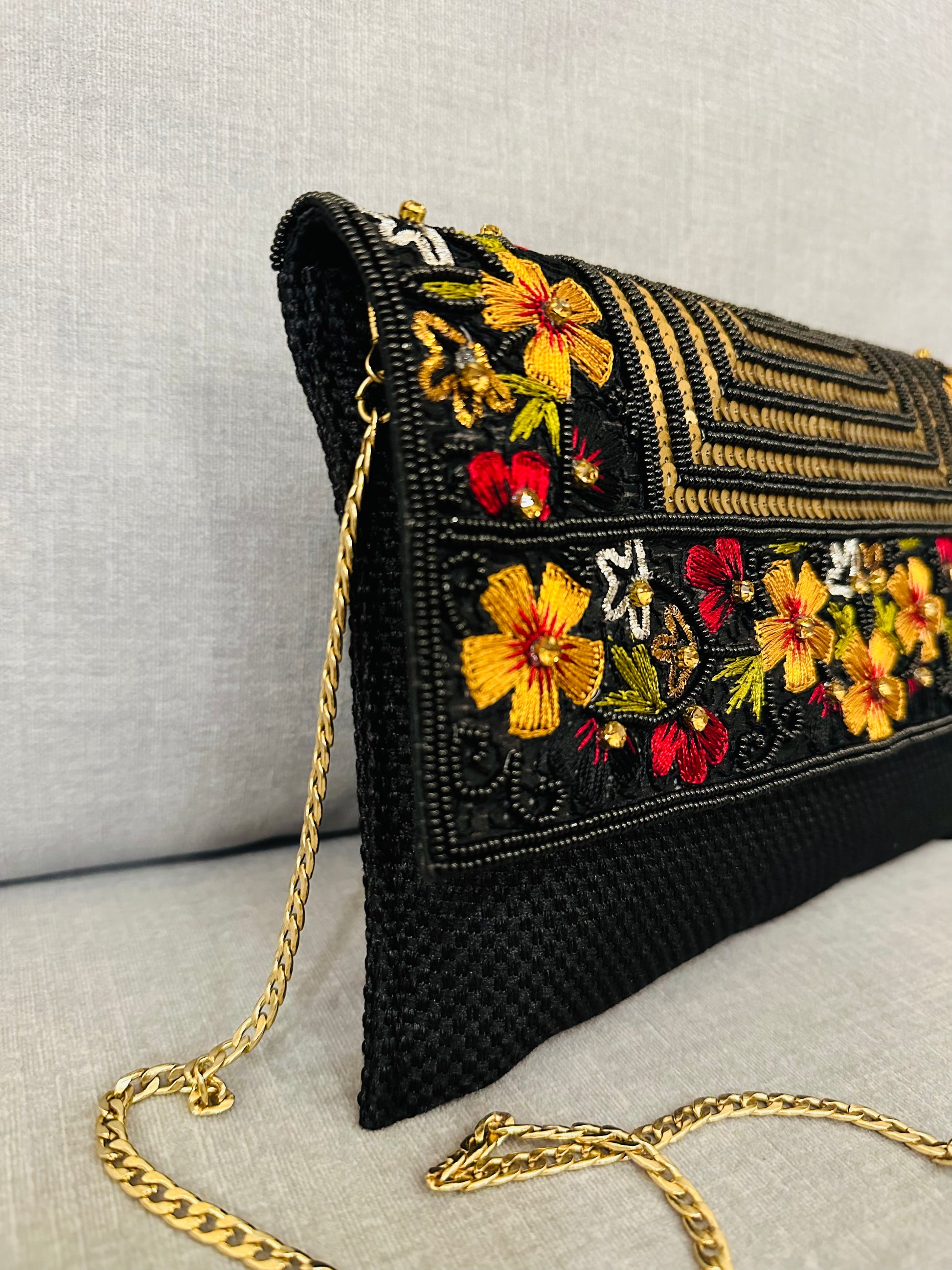 Handcrafted jute clutch with gold zardozi embroidery, magnetic closure, traditional Indian Bhopali Batua design