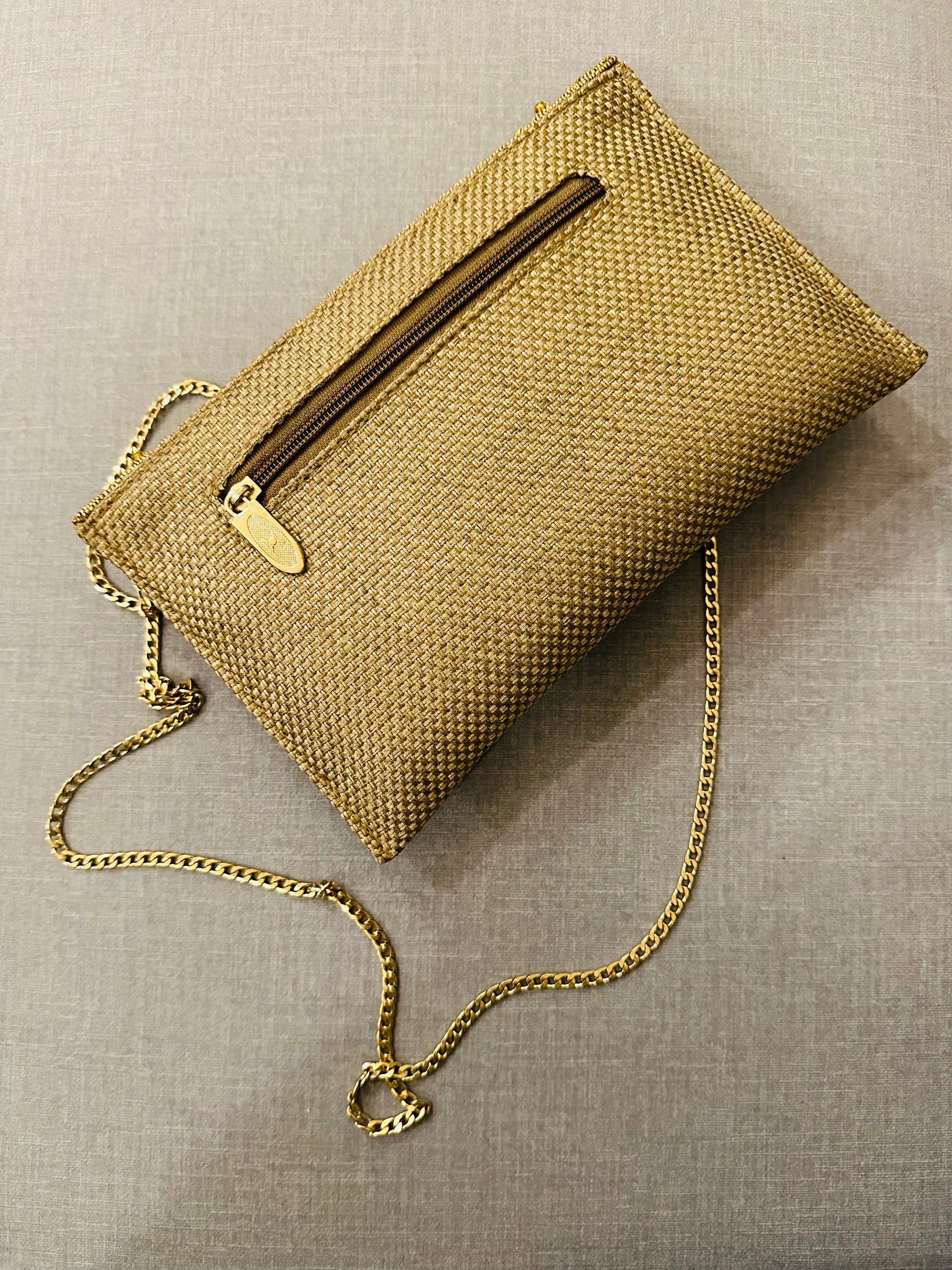 Handcrafted jute clutch with gold zardozi embroidery, magnetic closure, traditional Indian Bhopali Batua design