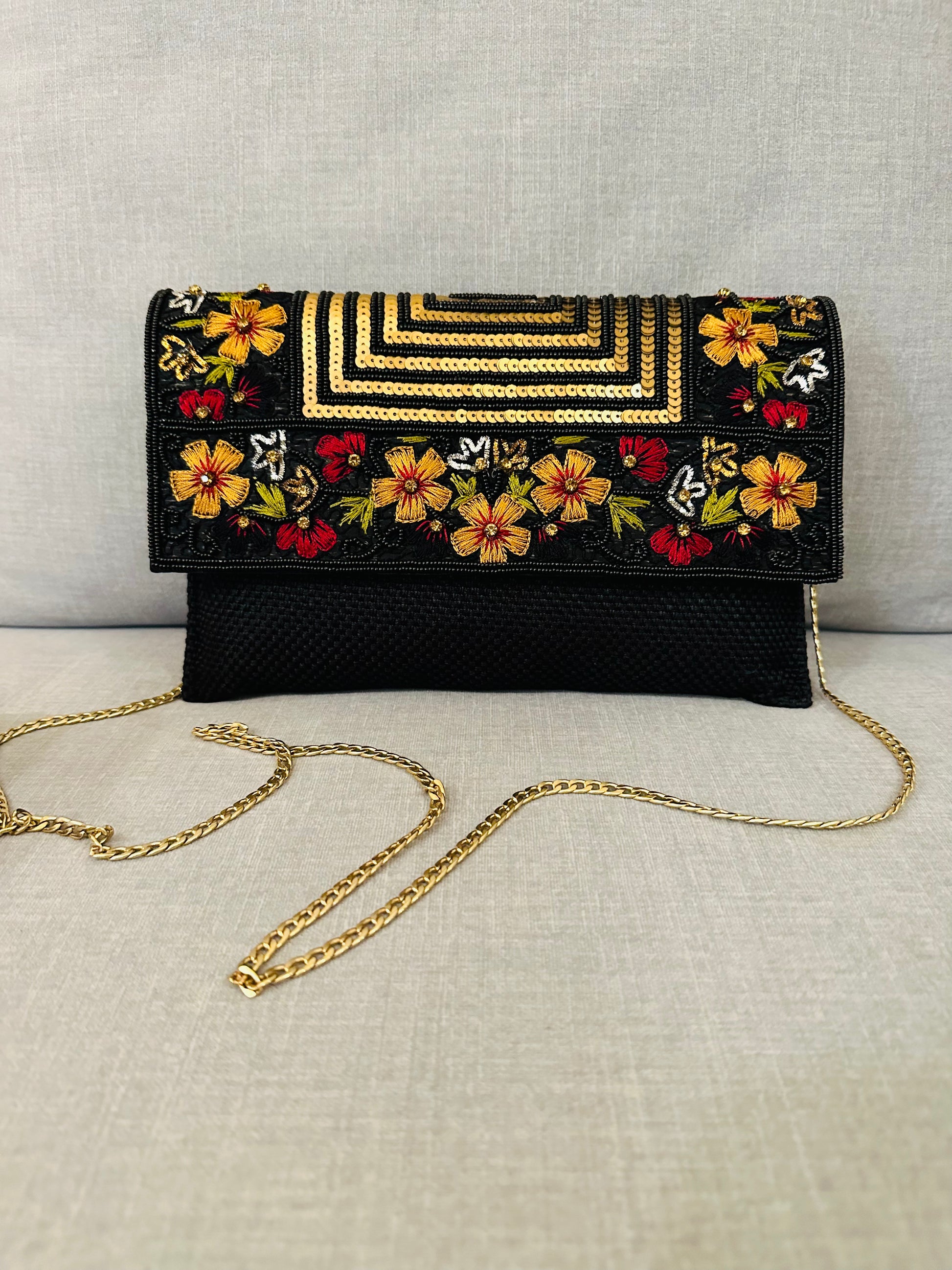 Handcrafted jute clutch with gold zardozi embroidery, magnetic closure, traditional Indian Bhopali Batua design