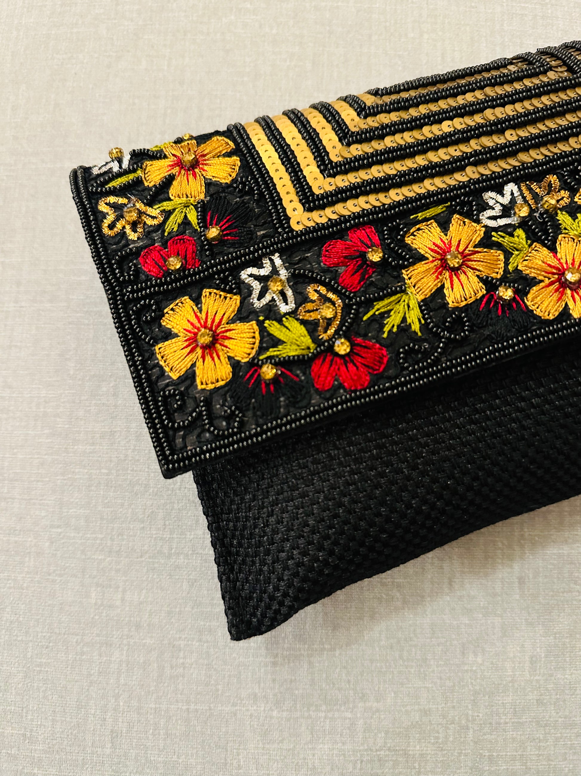 Handcrafted jute clutch with gold zardozi embroidery, magnetic closure, traditional Indian Bhopali Batua design