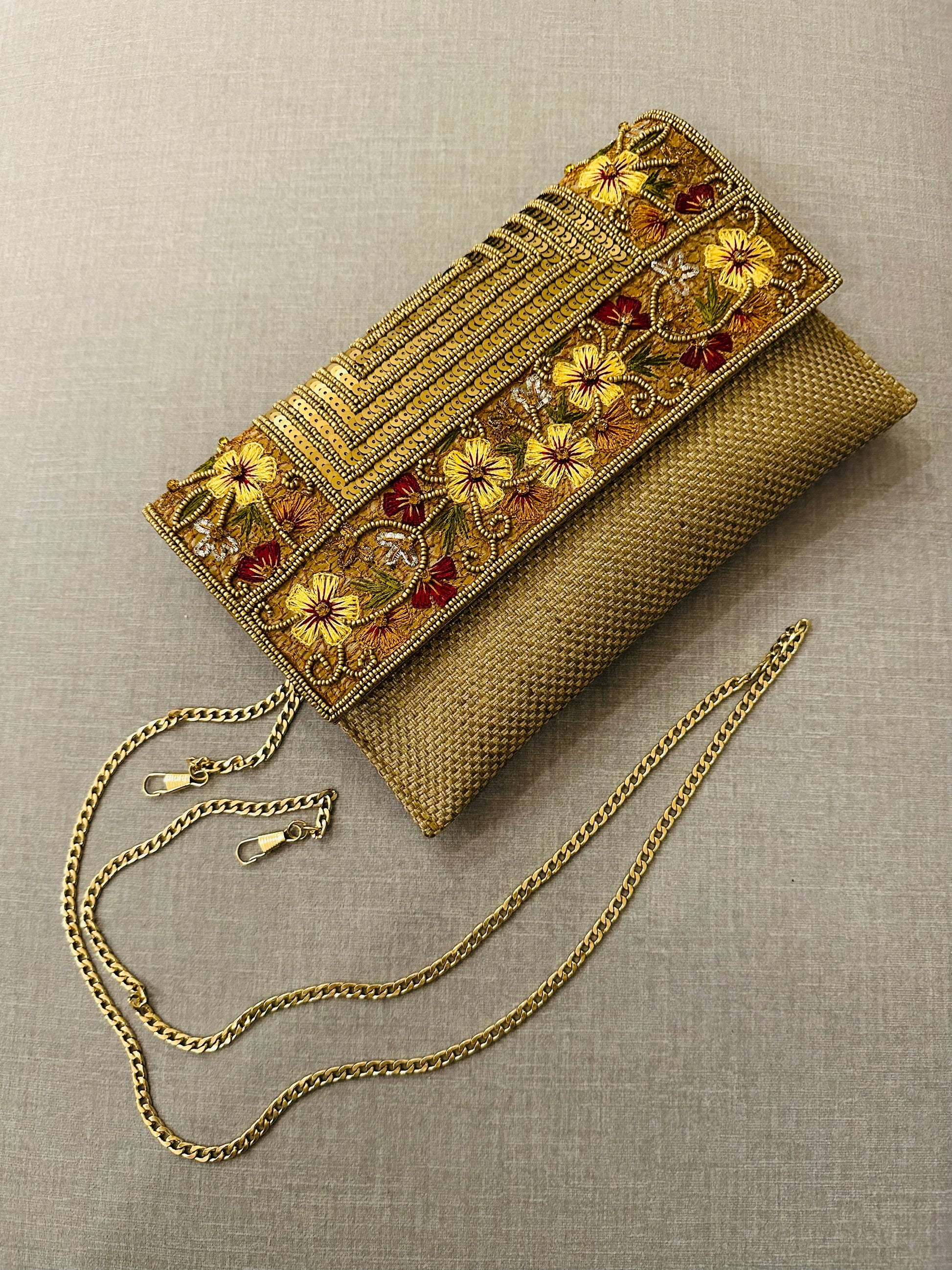 Handcrafted jute clutch with gold zardozi embroidery, magnetic closure, traditional Indian Bhopali Batua design