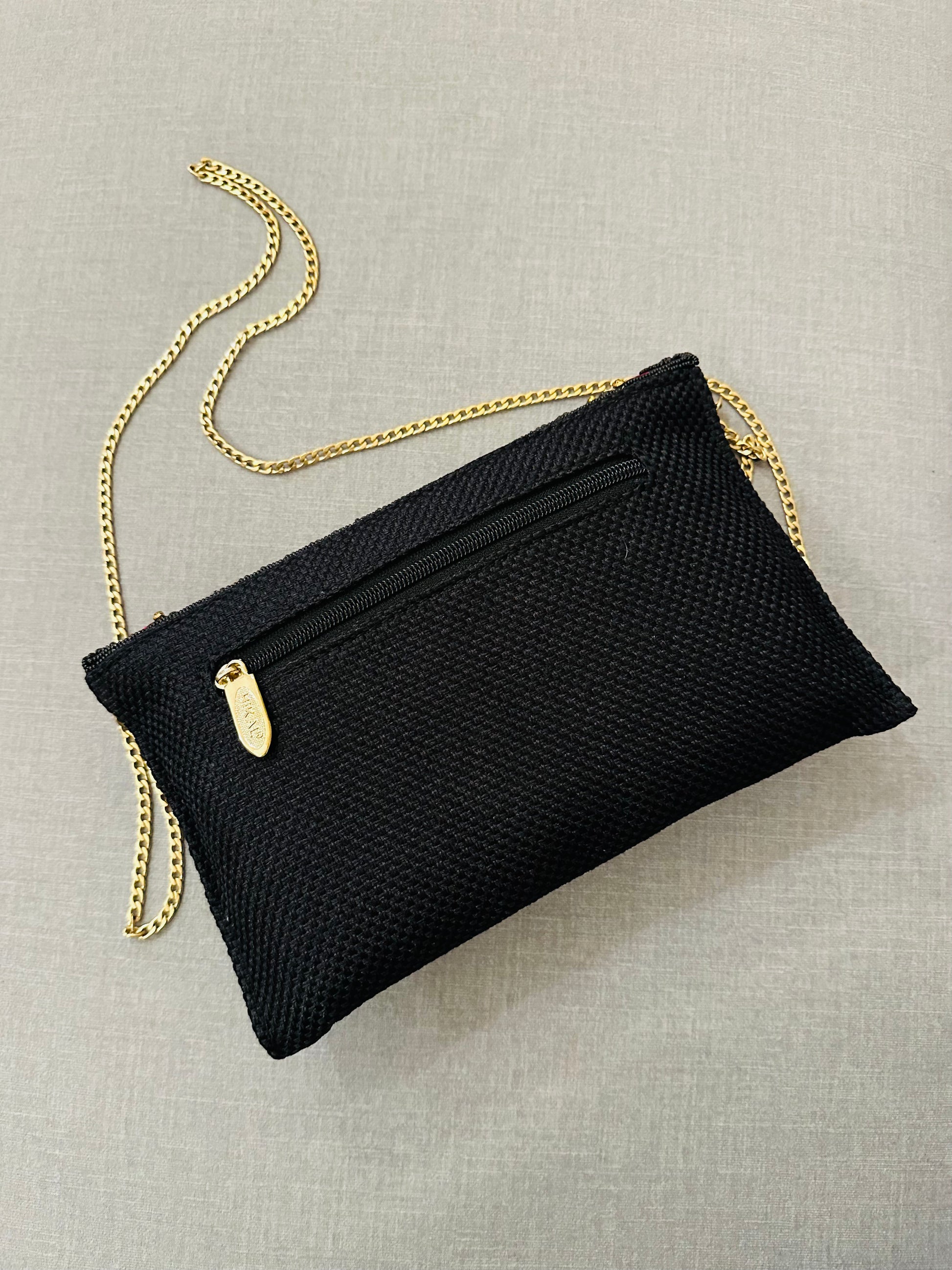 Handcrafted jute clutch with gold zardozi embroidery, magnetic closure, traditional Indian Bhopali Batua design
