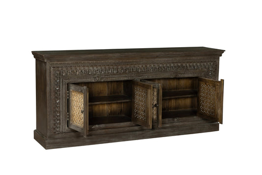 Dark wooden sideboard with decorative carvings on a white background