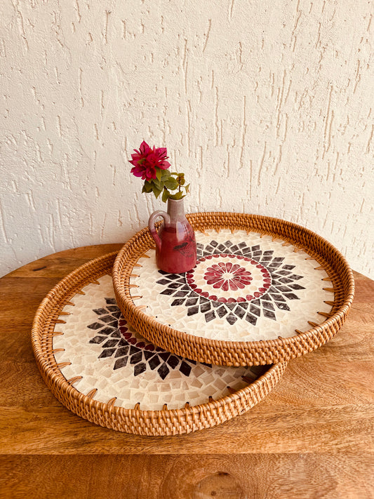 Round Mother Of Pearl Rattan Tray is made with handwoven rattan material mixed mother of pearl is durable and eco-friendly, add a natural touch to any room. Impress your guests with these beautiful hand woven serving trays made with natural Rattan. In effortlessly chic hand-woven round tray has a designer motifs on it which make it a center of attraction . It can also be beautifully used as a display piece on your coffee table as a wall decor. TESU