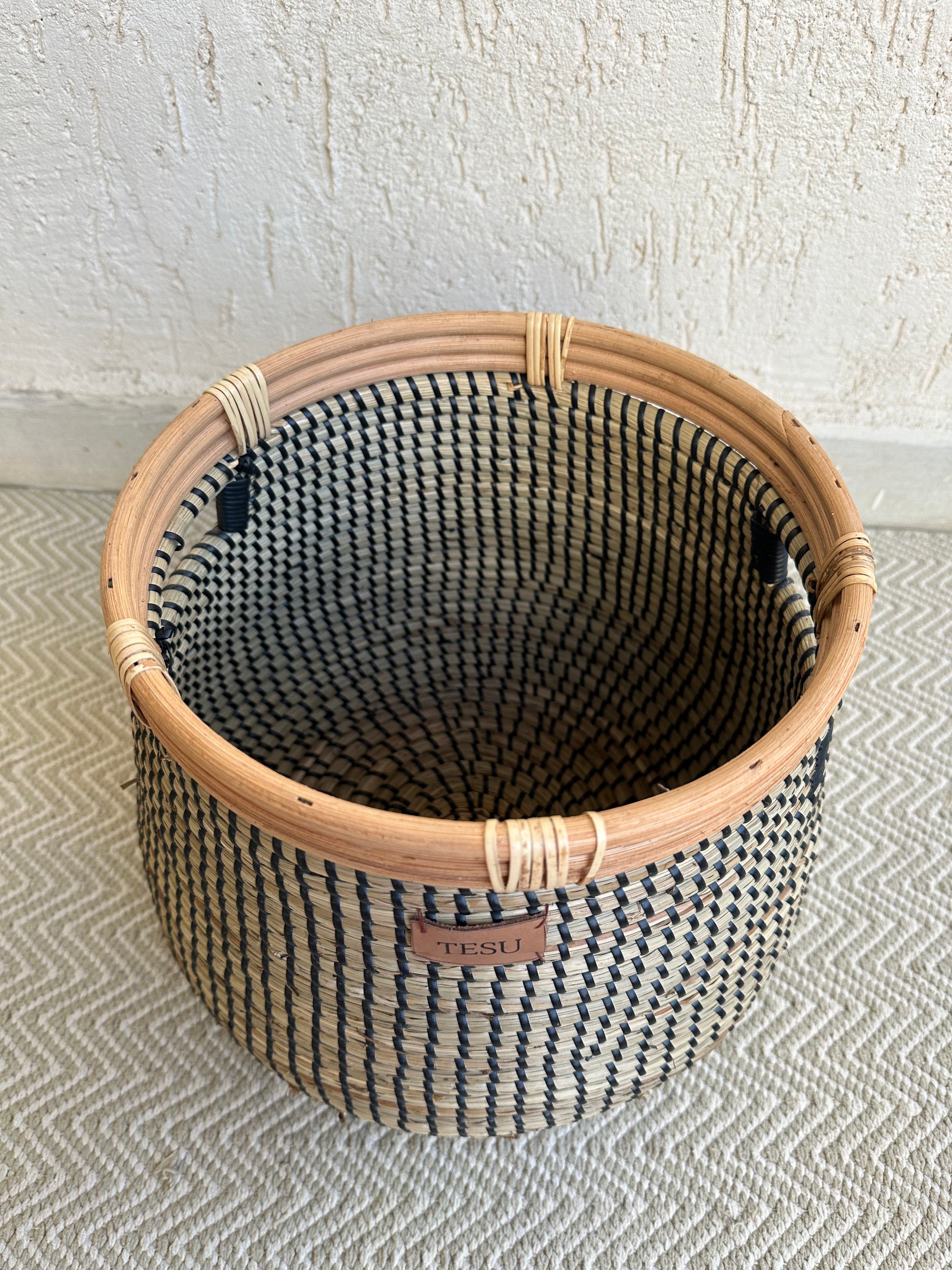Close-up of sustainable seagrass plant holder displaying eco-friendly craftsmanship and natural fibers