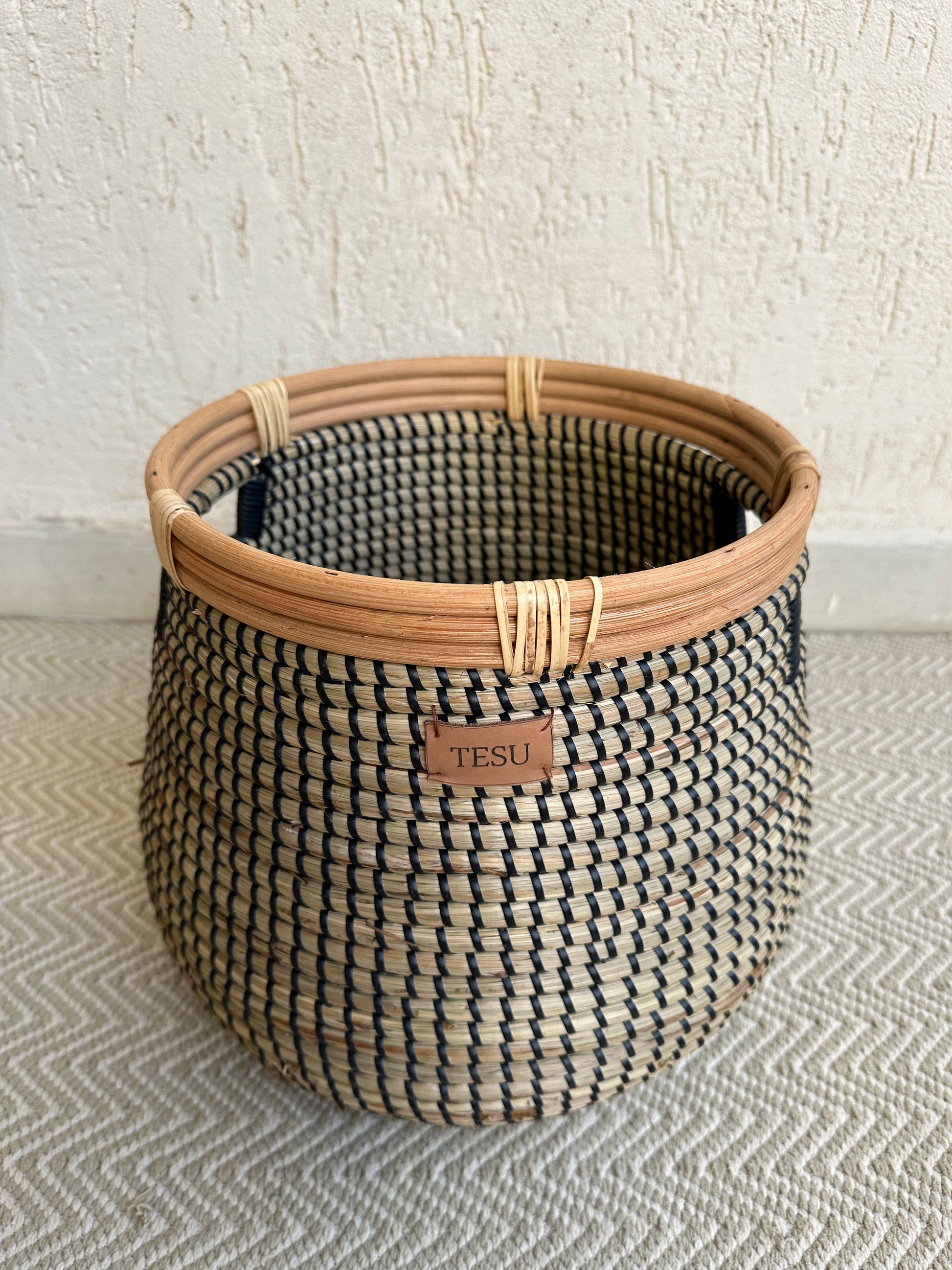 Natural seagrass storage basket showing artisan hand-woven texture and flexible placement design
