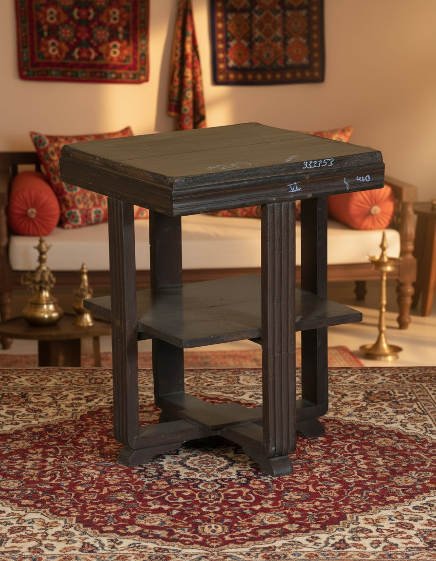 Wooden side table with two shelves on a textured floor and white wall background