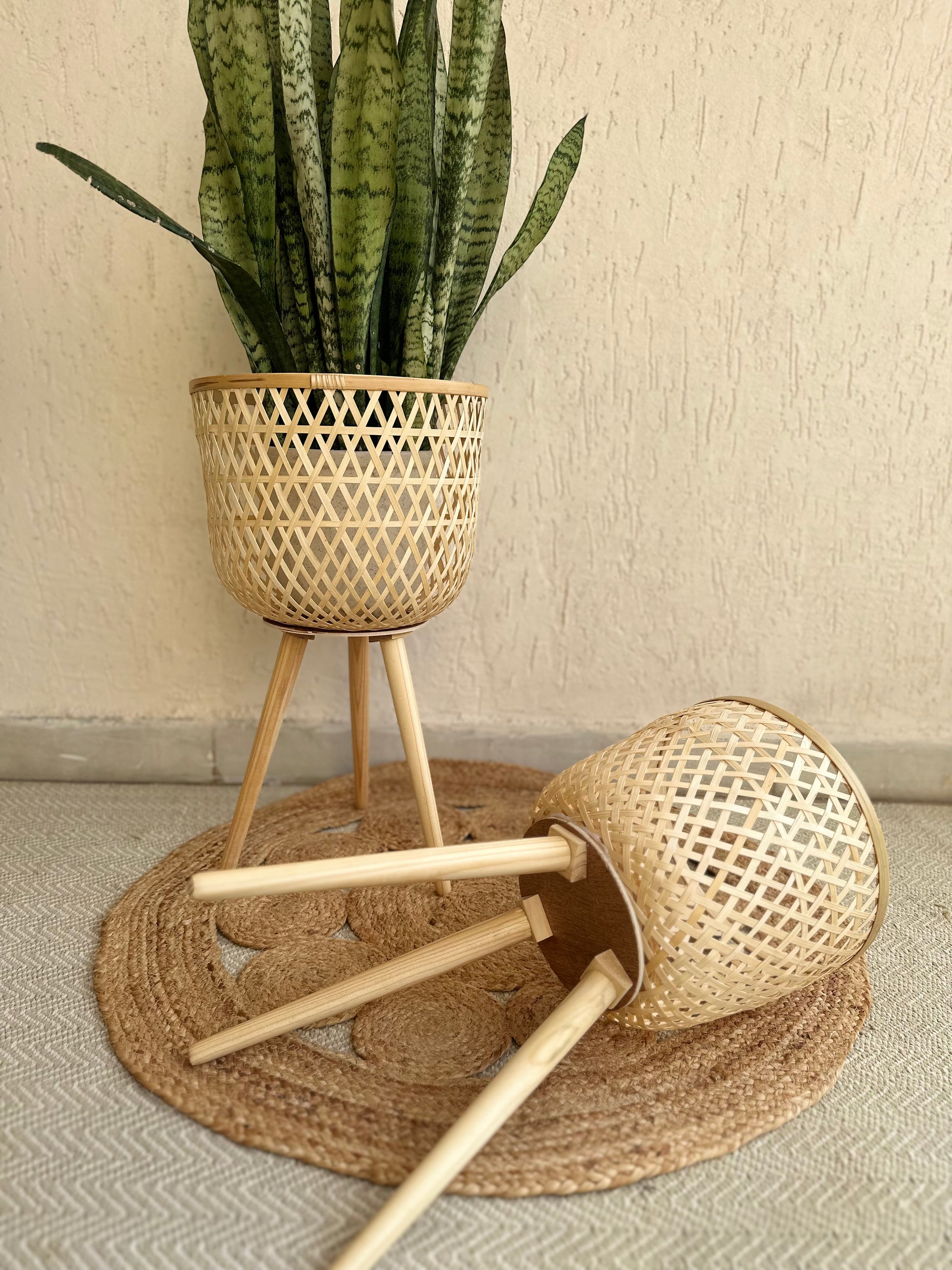bamboo light planter tesu with folding legs boho home style setup.Enhance your Dream Home with our curated selection of premium Home Décor items.  Typically crafted Bamboo woven planter with removable wooden legs are creating an eco -friendly and aesthetically pleasing container for plants. Its intricate handwoven design adds a touch of rustic charm to any to indoors as well as covered outdoor spaces like the living room, balcony, patio or a roofed terrace. tesu
