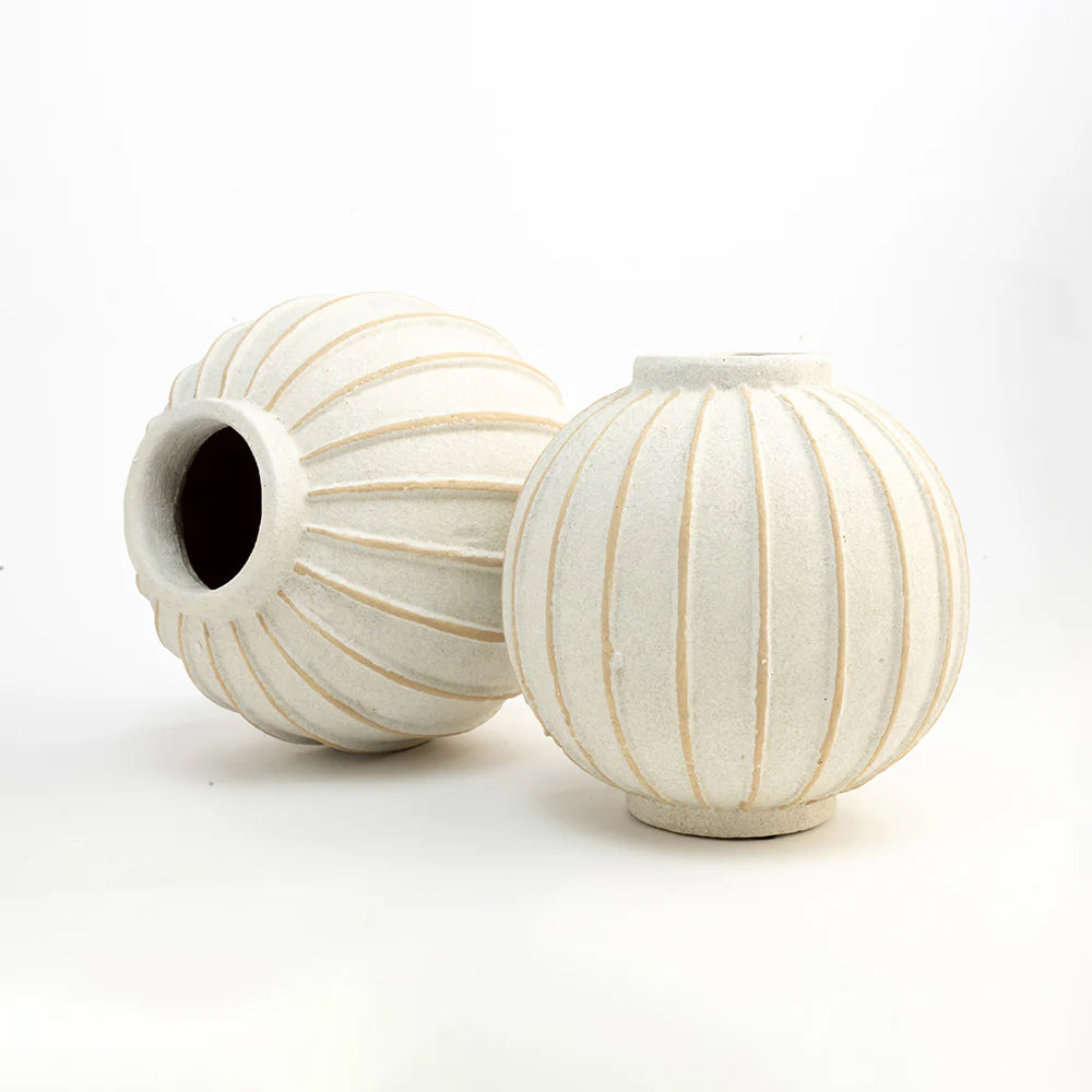 these vases are thoughtfully handcrafted from natural terracotta, blending artisanal texture with modern minimalism.