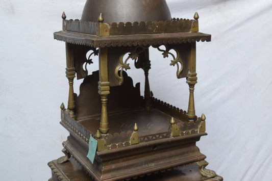  a meticulously handcrafted brass temple inspired by traditional Indian architecture