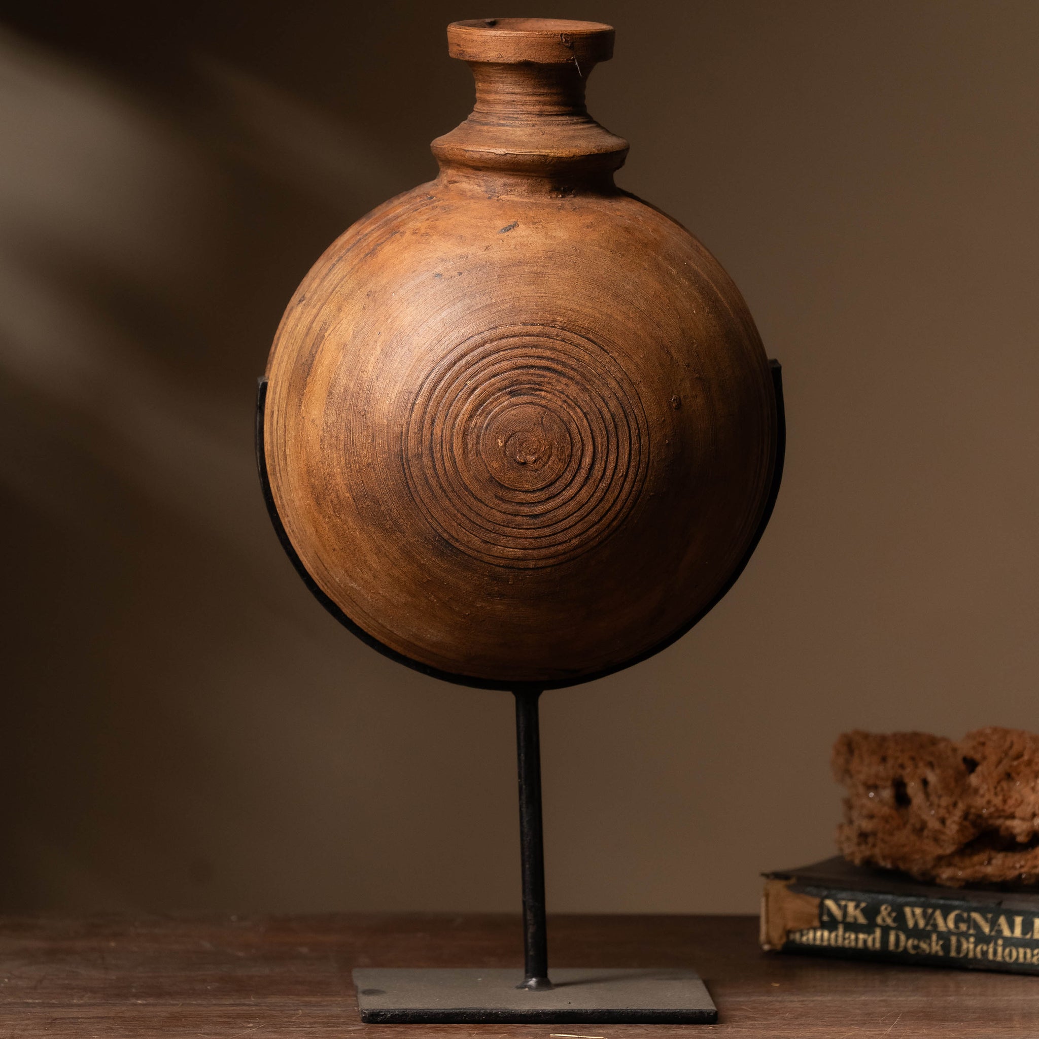 Step into a world where tradition meets sophistication with Tesu home decor Antique Black Clay Pot with Iron Stand.