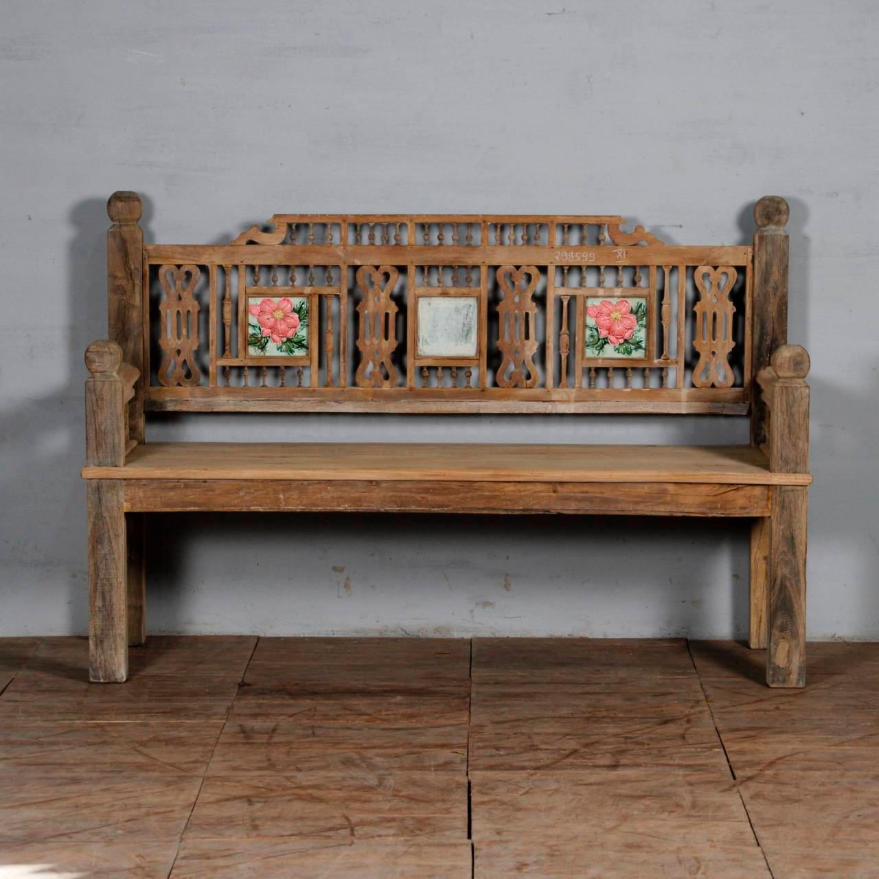 Close-up of hand-carved detail and distressed wood on antique bench – Tesu Furniture & Seating