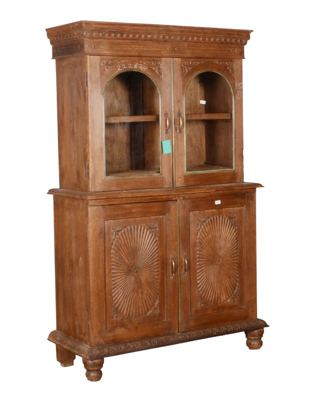  Featuring elegant arched glass doors, beautifully carved sunburst panels, and a refined architectural cornice, this two-part display cabinet blends heritage character with everyday functionality. 