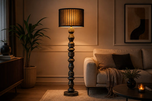 Living room with a tall floor lamp, sofa, and decorative items.