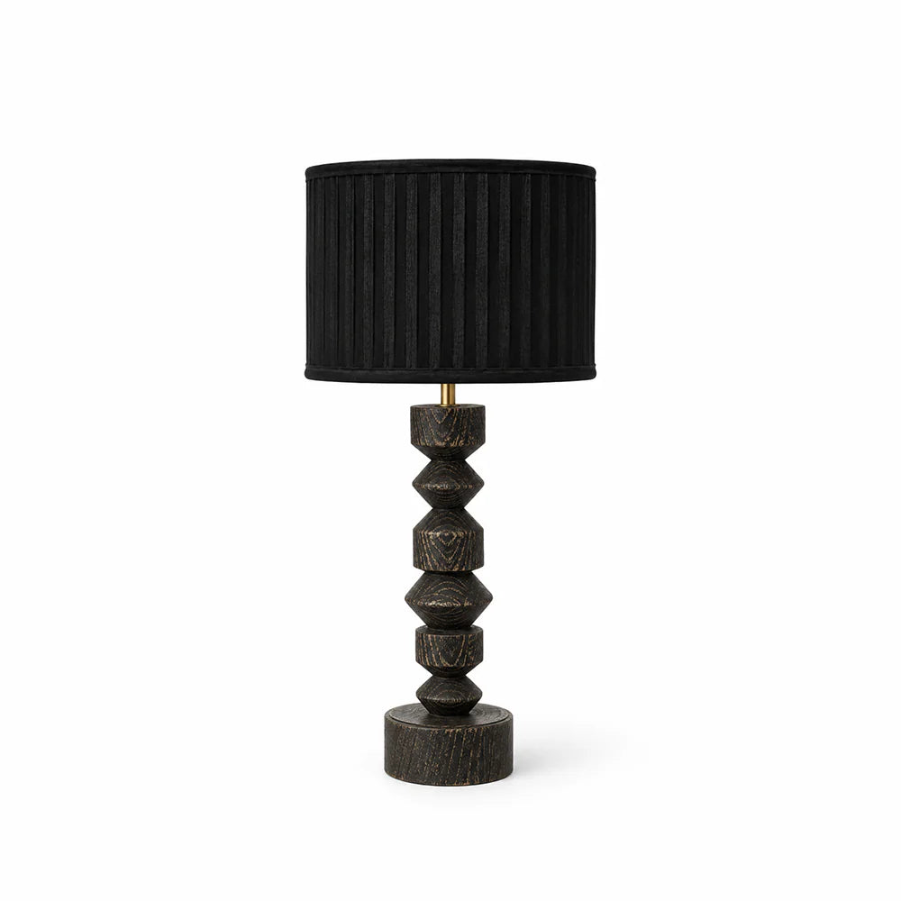 Black table lamp with a textured base on a white background