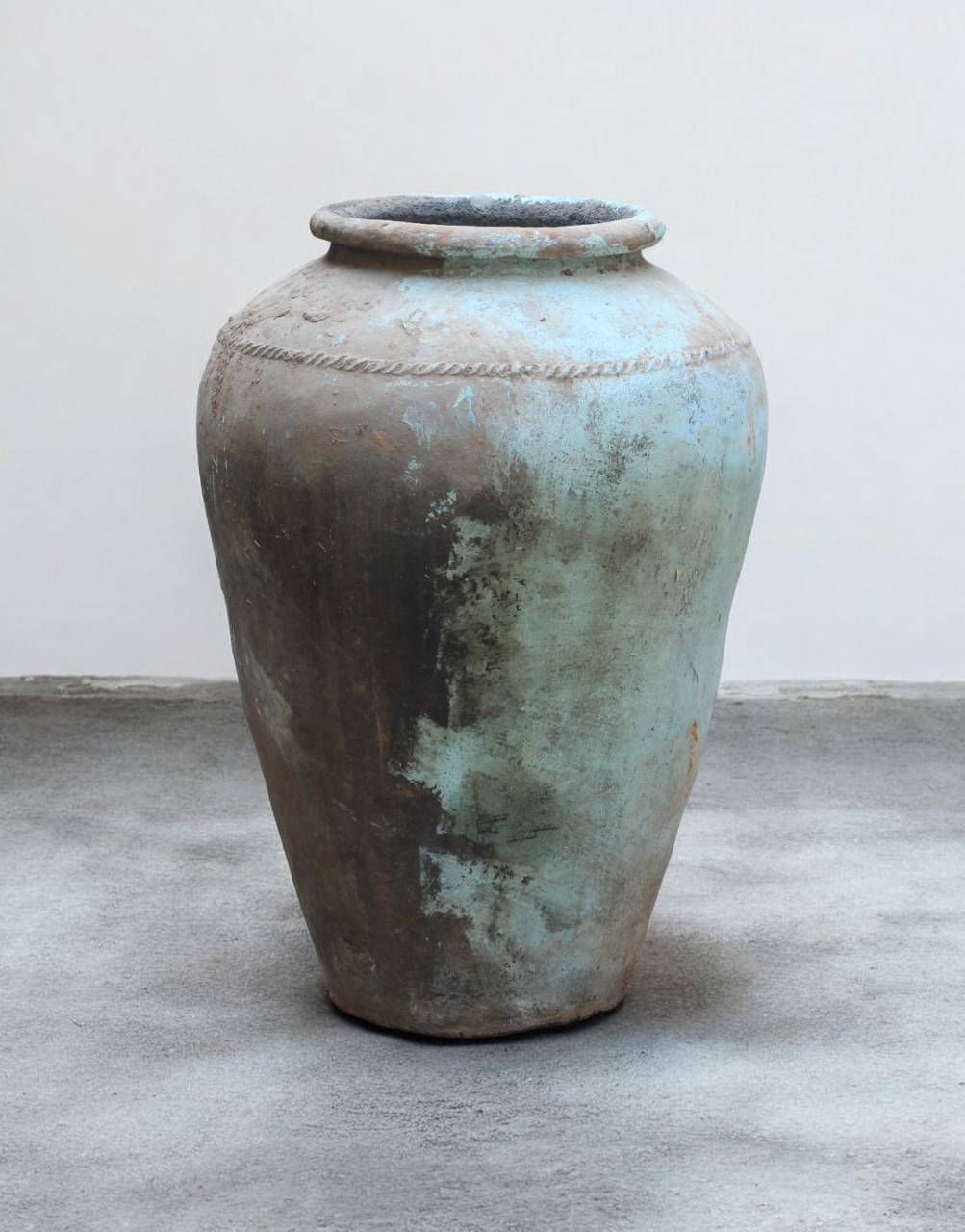 Vintage terracotta pot with a patina finish 