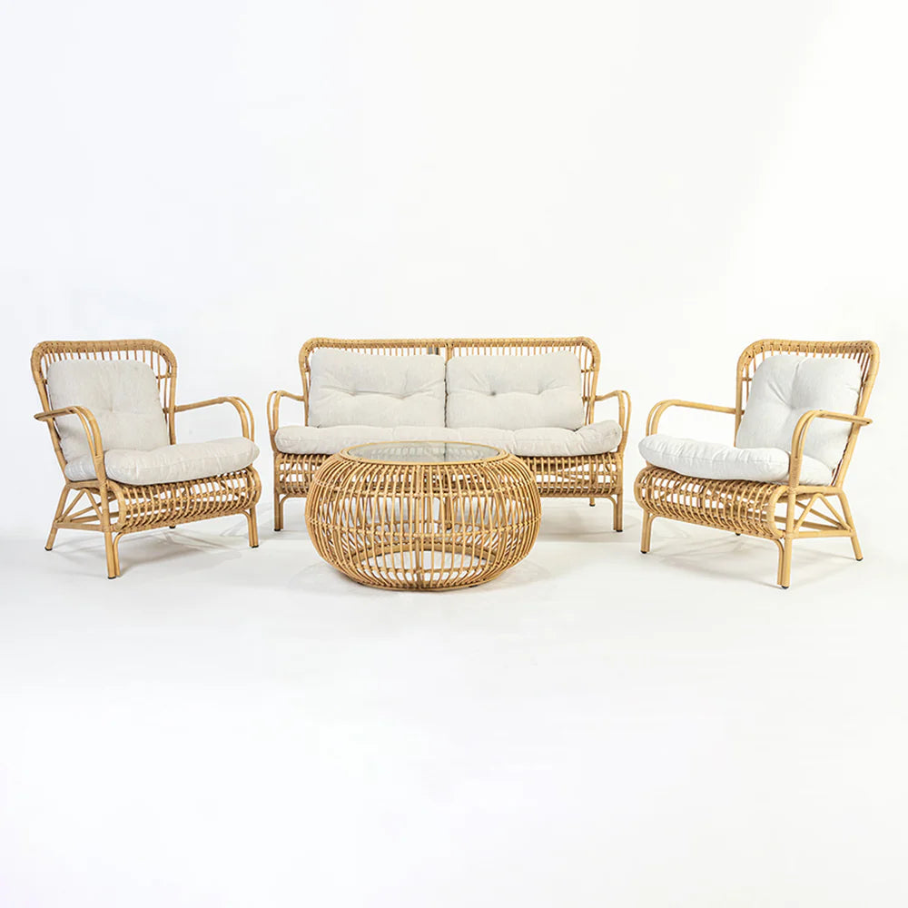 Wicker furniture set with two chairs and a sofa around a glass coffee table on a white background