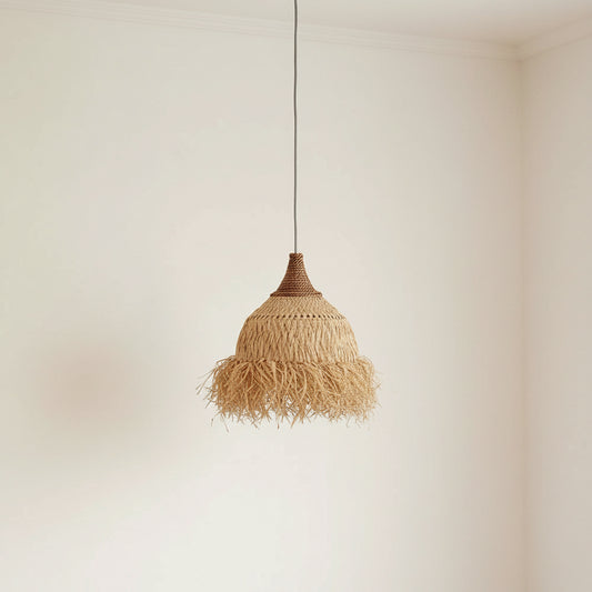Woven pendant light hanging against a beige wall with wooden furniture.