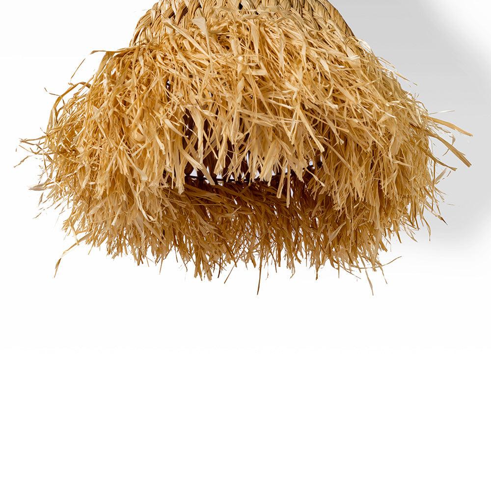 Coiled piece of straw on a white background
