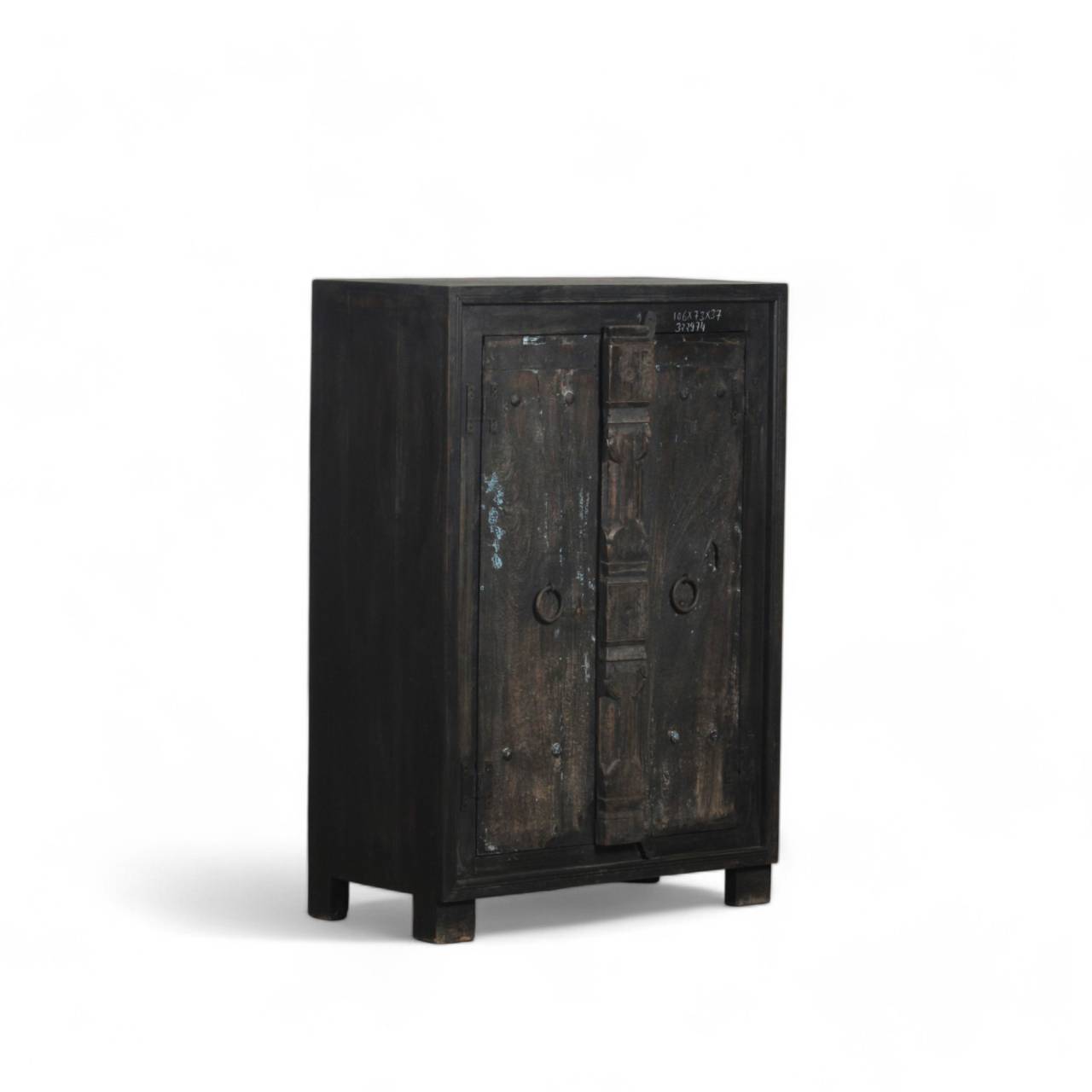 The sturdy double doors, adorned with subtle metal accents and distressed detailing, open to reveal spacious shelving, perfect for organized storage.