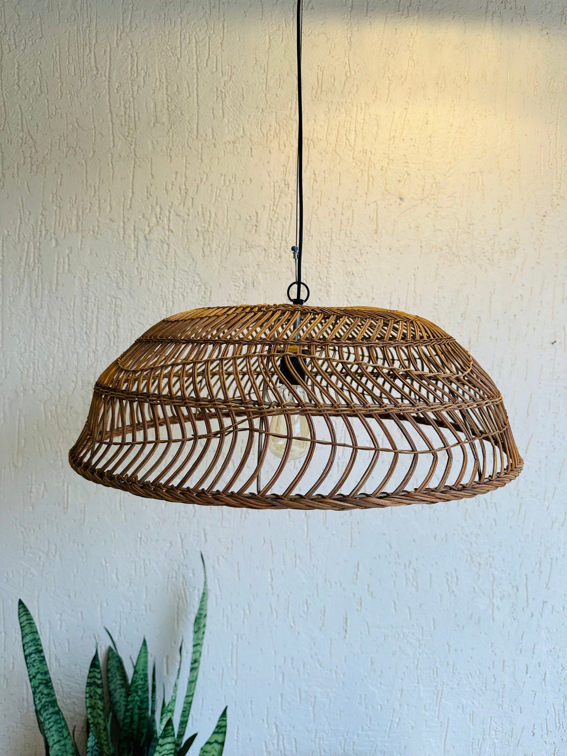 Handcrafted rattan pendant light adds bohemian charm to any space. Versatile design suits bedrooms, living areas, or covered patios. Expertly crafted for quality, adaptable to various ceiling heights. Each piece intricately woven by artisans, perfect for coastal, boho, or rustic decor. tesu