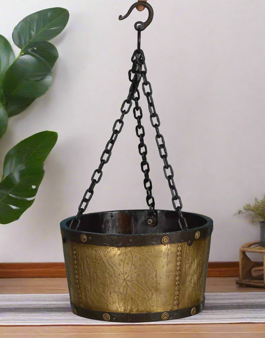 Elevate your indoor or outdoor décor with the Brasswood Hanging Planter, a stunning blend of vintage charm and handcrafted elegance. 