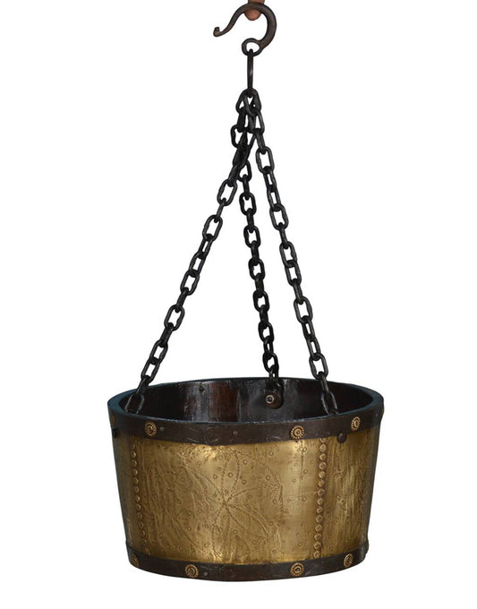 uspended by sturdy iron chains, this unique planter adds a regal and rustic touch to any space.