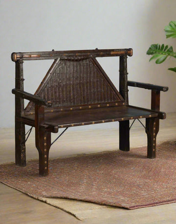 Discover timeless craftsmanship with the Brasswood Heritage Sofa, a handcrafted wooden bench made from solid teak wood, durable iron, and ornate brass accents. 