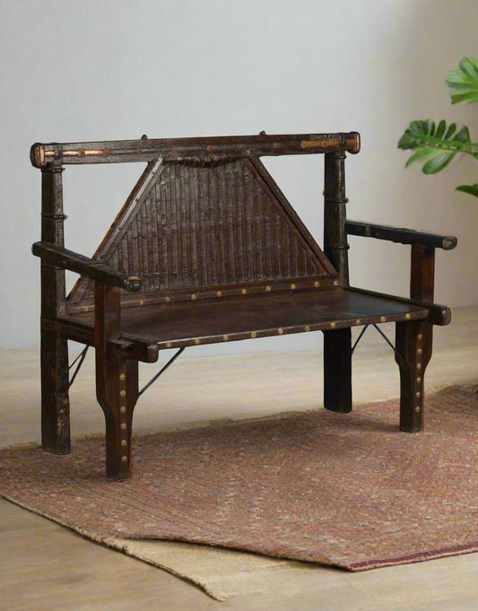 Discover timeless craftsmanship with the Brasswood Heritage Sofa, a handcrafted wooden bench made from solid teak wood, durable iron, and ornate brass accents. 
