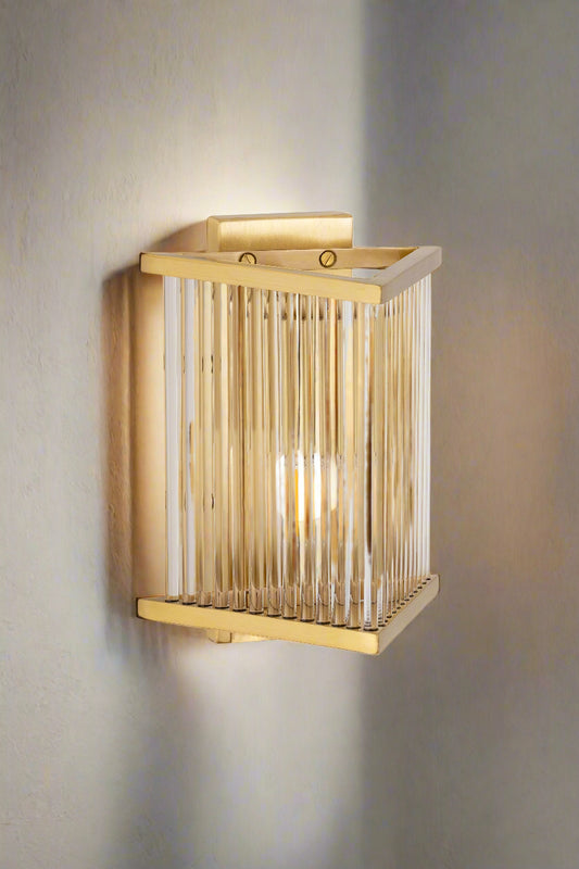 A Chandani Metal Glass Wall Light is a unique and stylish addition to any home decor, blending natural materials with modern design. 