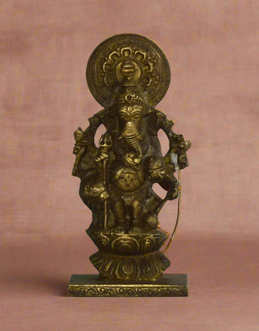 Embrace divine strength, wisdom, and royal grace with Chaturbhuj Raj Ganesh, a magnificent brass statue of Lord Ganesha standing in his glorious four-armed form. 