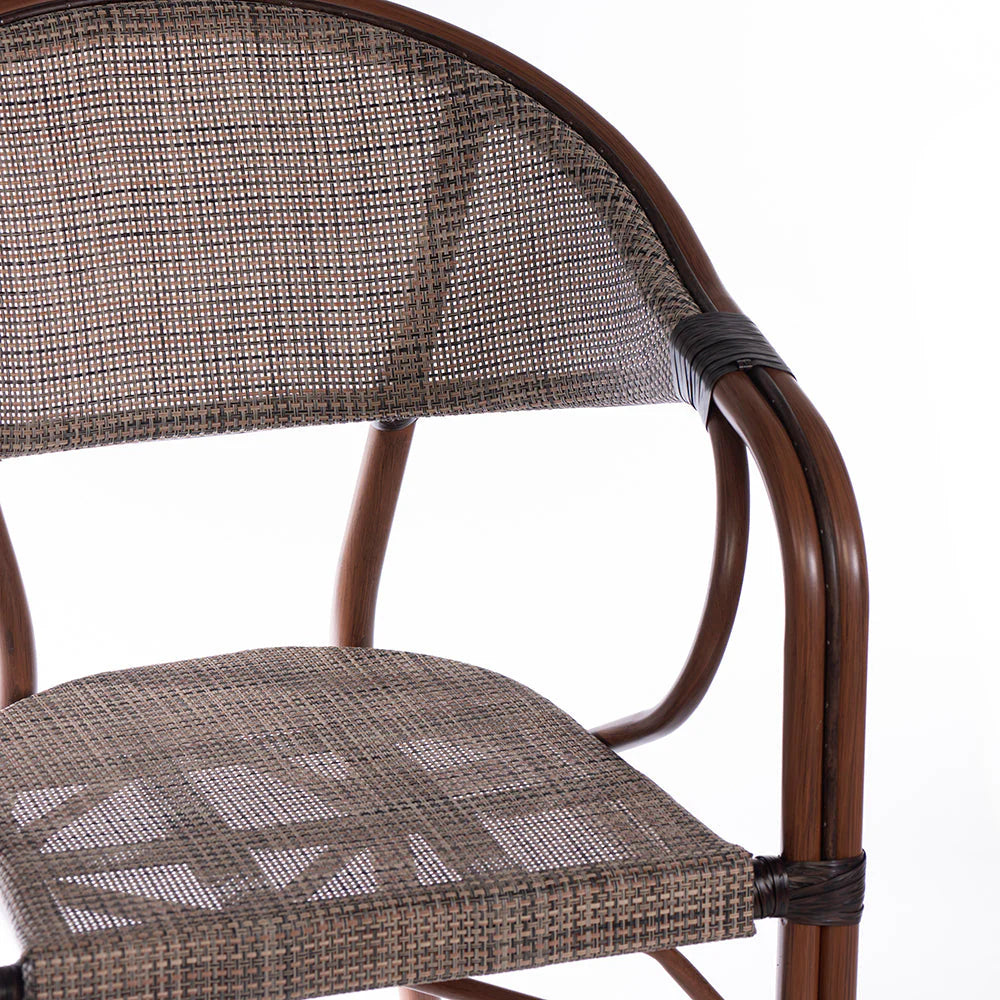 The Classic Woven Bistro Chair is a charming, timeless piece that brings a touch of vintage elegance and casual comfort to any setting. 