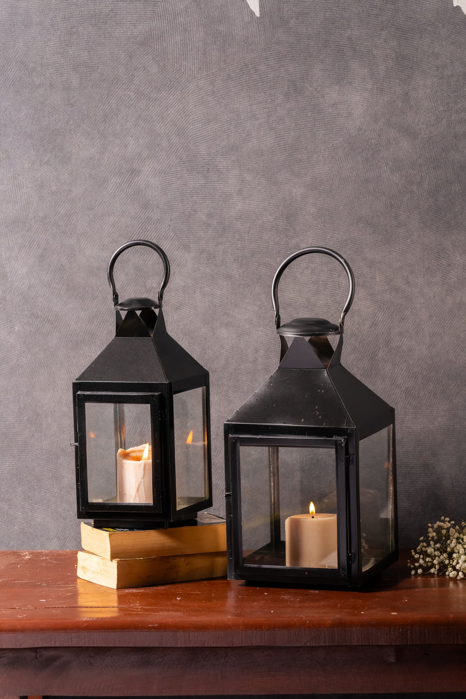 black metal lanterns
old-world elegance decor
indoor outdoor lanterns
cozy atmosphere lighting
sturdy lantern design
clear glass panel lanterns
rustic home decor
timeless lantern style
versatile lighting solutions
refined outdoor decor
decorative lantern set
stylish home accents
special occasion lighting
sleek black finish lanterns
charming lanterns for home