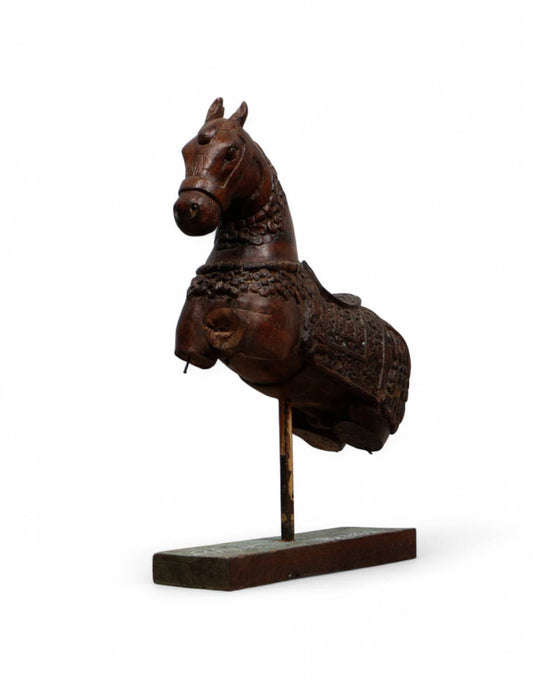 This striking bust of a horse, adorned in traditional armor and set on a sturdy iron stand, captures the regal presence of a battle-ready steed from history.