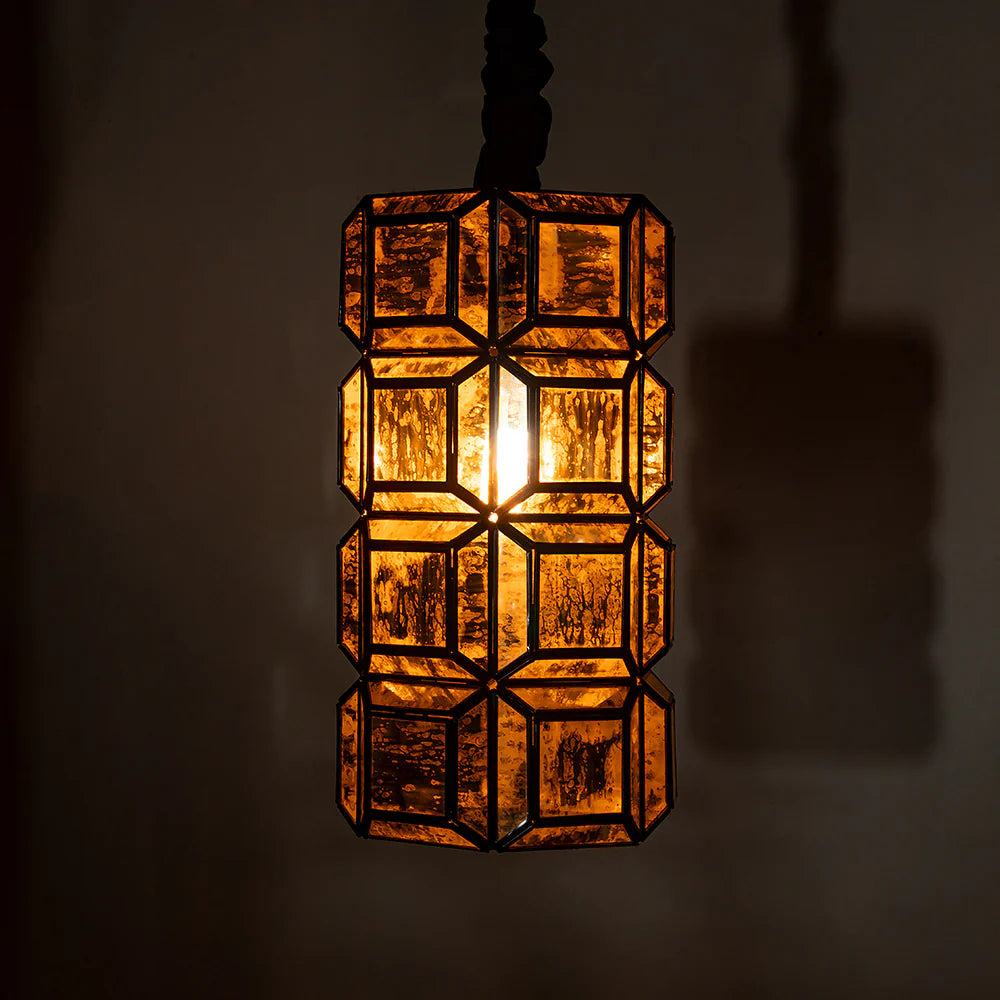  Its amber-toned, textured glass panels diffuse light into a warm, 