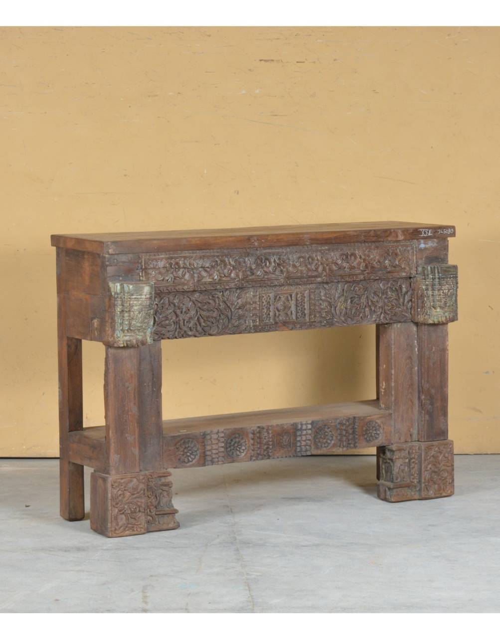 This console showcases intricate floral carvings across the apron,