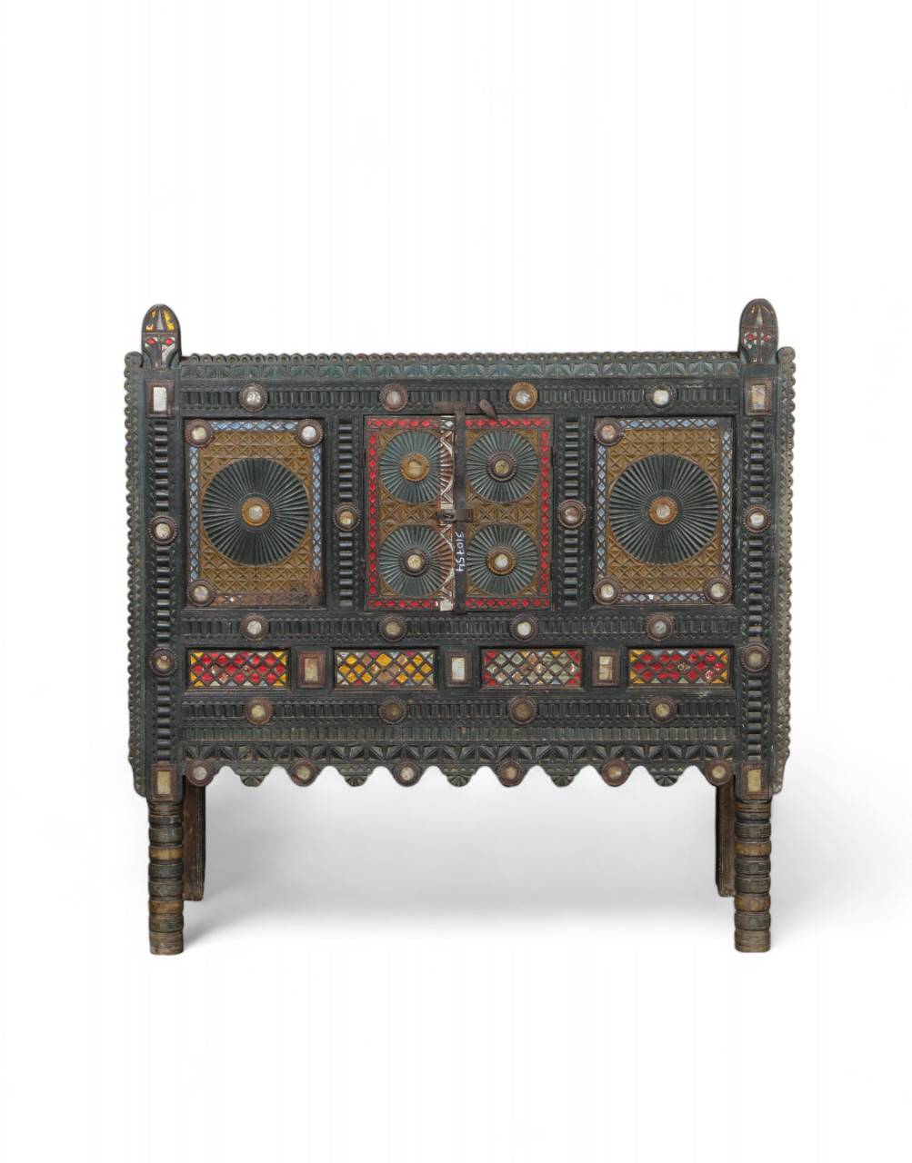  Handcrafted from reclaimed wood and iron, this piece features a richly carved facade adorned with mirror work and mandala-inspired motifs. 