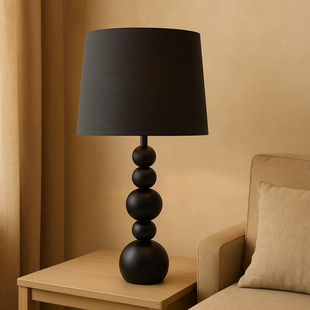 The Eclipse Glow Table Lamp is a statement piece that merges sculptural form with warm, ambient light.