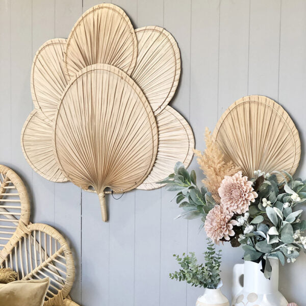 Palm Leaf Wall Fan Boho, Enhance your Dream Home with our curated selection of premium Home Décor items. Handwoven by skilled artisans, these Palm Leaf Wall Fans feature a simple spiral design and come with a hook for easy hanging. Perfect for a boho home. tesu