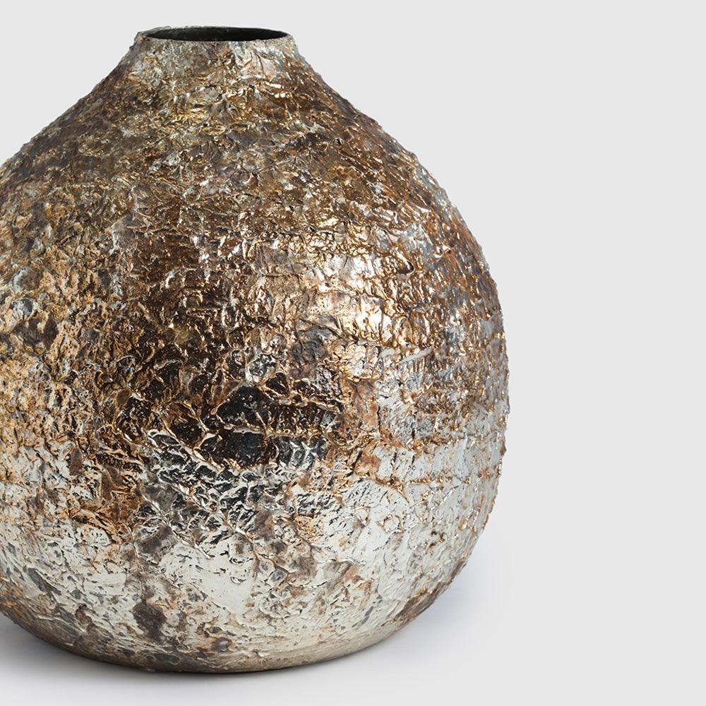  With its sculptural form and artisanal surface detailing, 