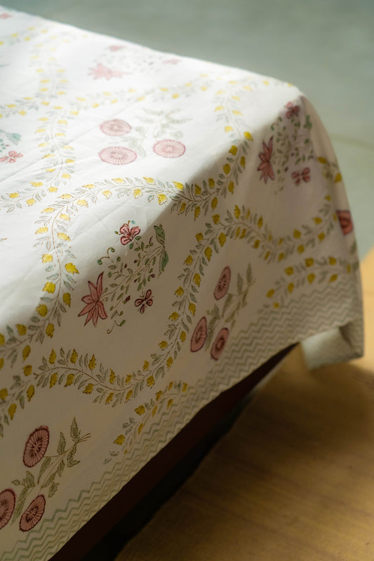 Floral patterned tablecloth on a wooden surface