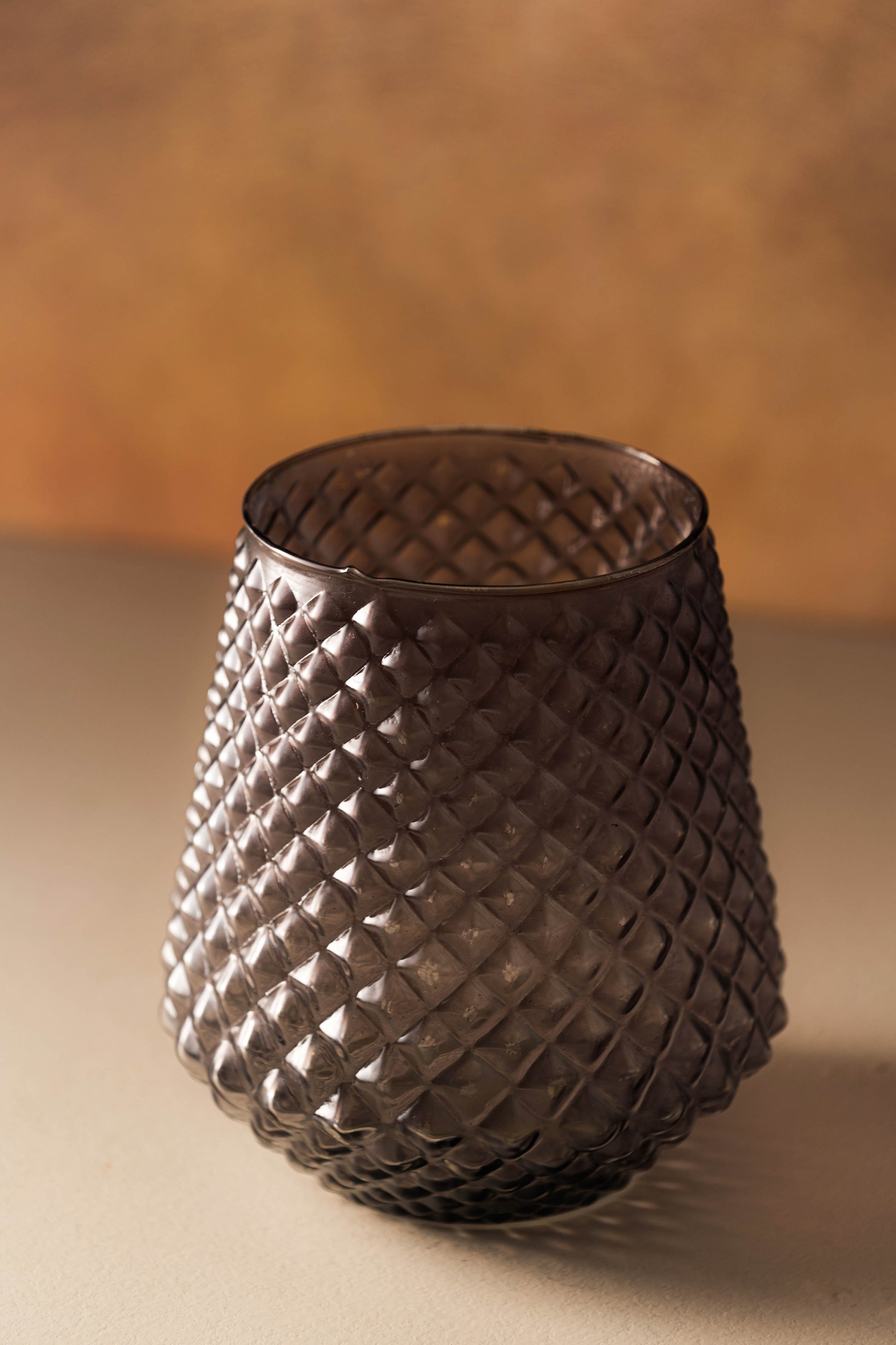 Textured glass vase on a neutral background