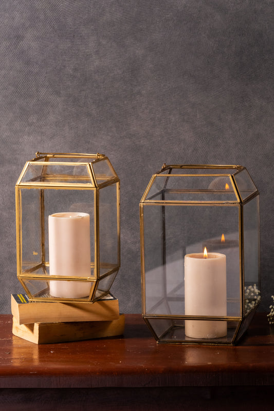 modern elegance lantern
clear glass candle holders
golden metal frame lantern
ambient glow lighting
stylish home decor
geometric design lantern
contemporary candle holder
versatile decor piece
indoor outdoor lanterns
timeless home accents
chic living room decor
elegant bedroom lighting
decorative lantern collection
warm lighting solutions
sophisticated home accessories